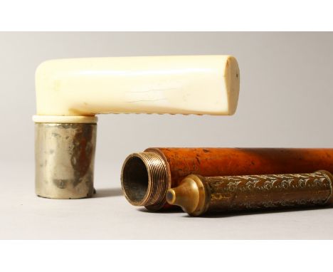 A 19TH CENTURY MALACCA CANE, with screw-off ivory and white metal handle, to reveal a lamp lighter. 35ins long.