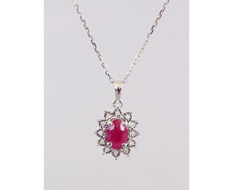 A 9CT GOLD, RUBY AND DIAMOND CLUSTER PENDANT AND CHAIN.