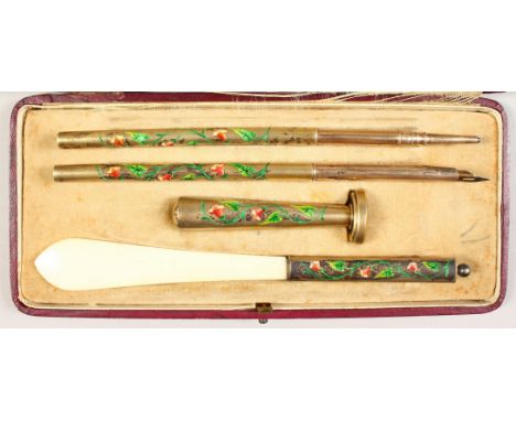 A SILVER AND ENAMEL PEN SET, in a fitted case, comprising seal, knife, pencil and pen.