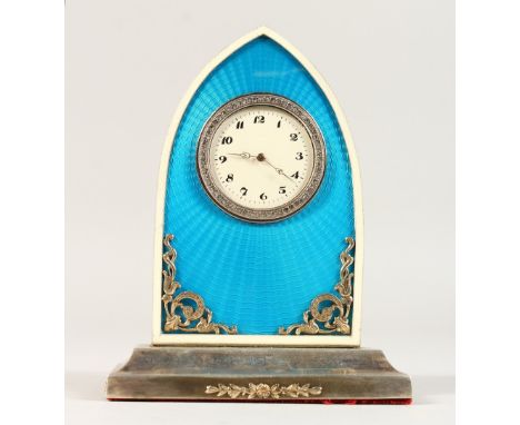 A GOLD FABERGE STYLE BLUE ENAMEL AND SILVER CLOCK, on a stepped base. 12cms high.