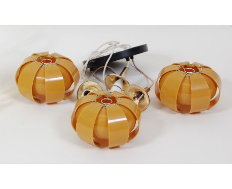 A 1970s amber coloured plastic three-branch hanging ceiling light, having brushed metal attachments, the shades each of layer