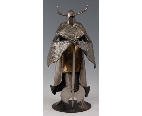 A contemporary burnished steel figure of a medieval knight, holding a twin bladed axe, the helmet with double sharpened horns