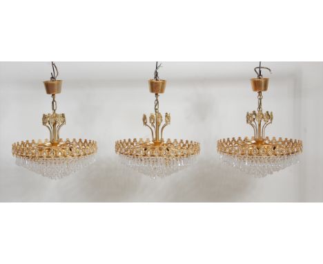 A set of three contemporary gilt metal and cut crystal glass drop hanging five-light electroliers, each of circular shallow t