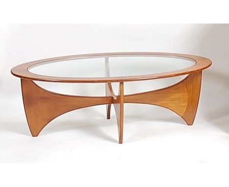 A 1960s G-Plan teak and smoky glass inset 'Astro' oval coffee table, raised on shaped interlocking supports, h.42cm, length 1