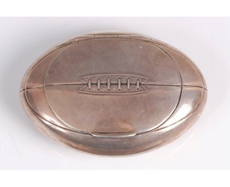 An unusual early 20th century novelty silver snuff-box in the form of an American football, with hinged cover, gilt-washed in