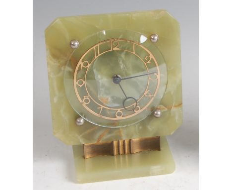 An Art Deco onyx and gilt brass mantel clock, with pierced stylised chapter ring enclosed by convex glass, with Smiths eight 