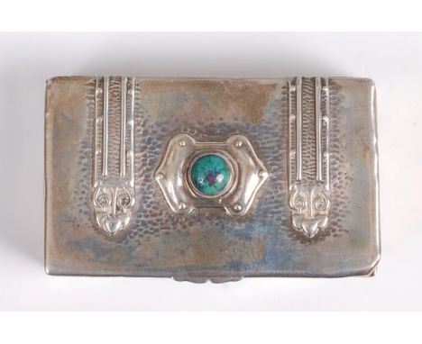 An Arts & Crafts silver snuff-box in the form of a Gothic Revival chest, applied strapwork decorated, the hinged cover with p
