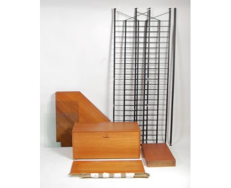 A 1970s Ladderax modular corner wall unit, comprising four deep corner shelves, one fall-front compartment, a single 3ft shel