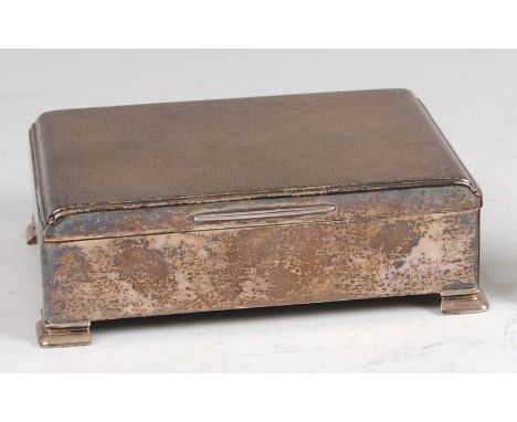 A 1950s silver engine turned table cigar box, the slightly stepped hinged cover enclosing a cedar lined twin division interio