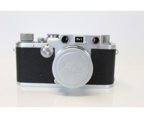 A Leica III F Red Dial 35mm camera N. 633367 - fitted with a 5cm Summicron lens with maker's case and cap