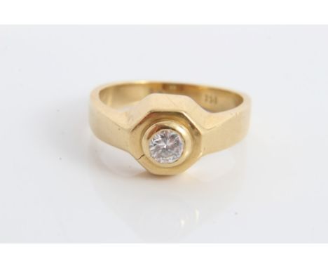 Gold (stamped 750) diamond single stone ring, with a brilliant cut diamond estimated to weigh approximately 0.20 carats, in r