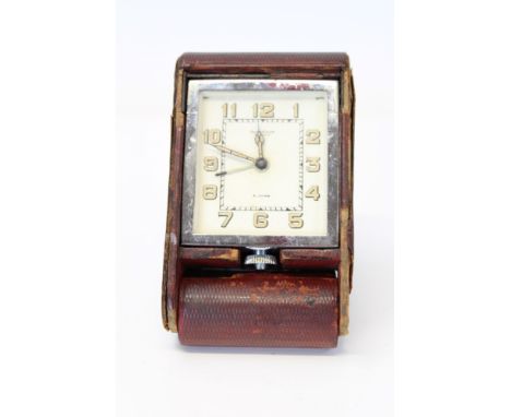 Jaeger-LeCoultre eight hour travelling alarm clock in red leather case.  Serial no. 025444