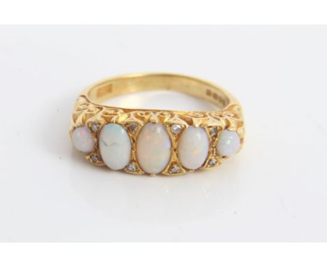 Gold (18ct) five stone opal ring interspaced with eight diamonds in scroll setting.  Ring size M CONDITION REPORT Total gross