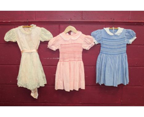 Selection of vintage little girl's clothes - including pink and white striped dress with hand-smocking and matching pants, si