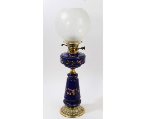 Late 19th / early 20th century oil lamp with etched globular shade and floral painted blue glass reservoir and flared stem wi