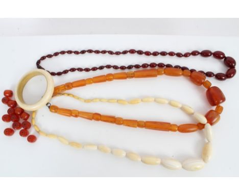 One antique ivory bead necklace, ivory bangle, two amber-type necklaces and beads