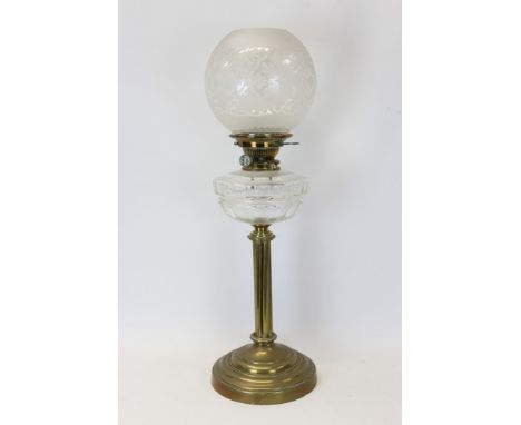 Late 19th / early 20th century oil lamp with Hinks no. 2 burner, clear cut glass reservoir and etched globe shade, on a brass