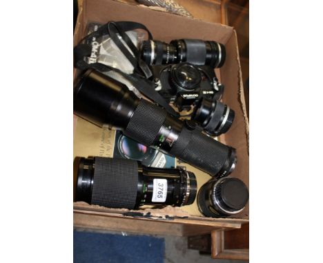 Olympus OM4 Ti SLR camera, plus three Olympus lenses 35-105mm, 50mm and 100mm and three other Vivitar lenses