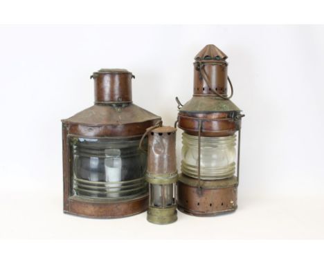 Two vintage copper ships' lanterns, together with a miners' safety lamp (3)