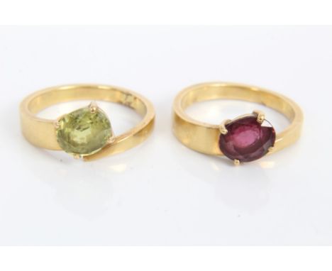 Two gold (stamped 750) gem set crossover rings - both size M CONDITION REPORT Total gross weight approximately 8.9 grams