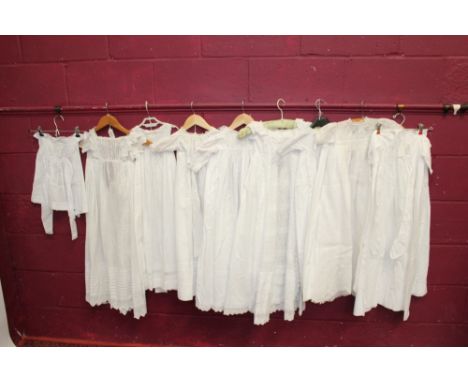 Selection of babies' christening gown, nighties and petticoats, white cotton with lace, pintucks and embroidery, also a large
