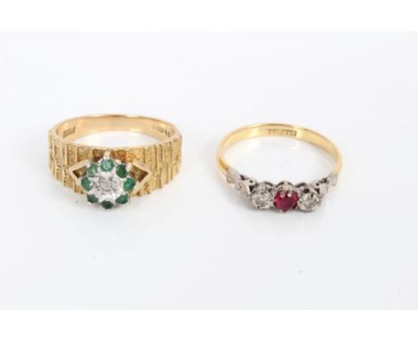 Gold (18ct) ruby and diamond three stone ring in platinum setting and a gold (9ct) emerald and diamond flower-head cluster ri