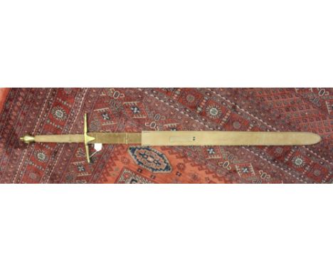 A reproduction Braveheart-style sword with simulated Mel Gibson signature to scabbard