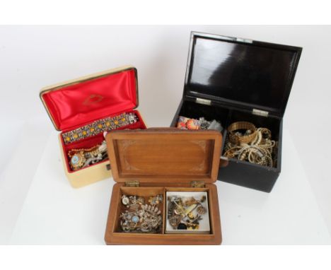 Three jewellery boxes containing costume jewellery, vintage brooches, enamel pins, bead necklaces, etc