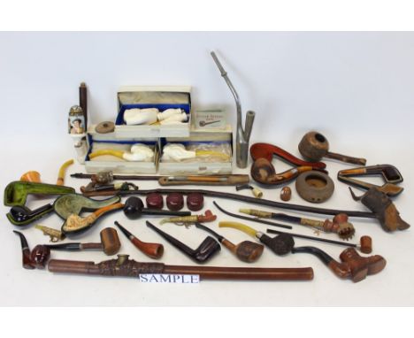 Large collection of old pipes - including meerschaum, porcelain, briar and others, an opium pipe, a Goudron with hallmarked s