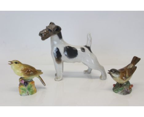 Royal Copenhagen model of a wire-haired terrier, model no. 1452 and two Royal Worcester birds - Sparrow 3236 and Nightingale 