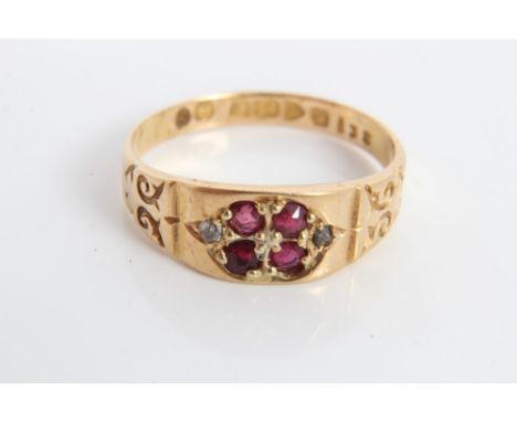 Edwardian gold (18ct) ruby four stone ring with engraved scroll shoulders (Chester 1902).  Ring size K CONDITION REPORT Weigh