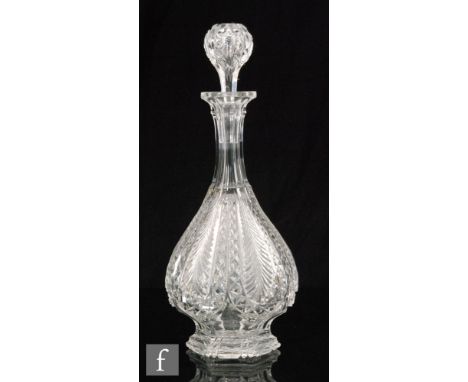 A late 19th Century Stourbridge clear crystal decanter having a sloped body with vertically cut alternating bands of hobnail 