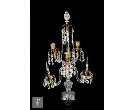 A late 18th Century three light candelabra circa 1790, square lemon squeezer base rising to a facet and printie cut hollow ba