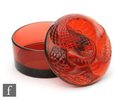 A later 20th Century Lalique powder box after designs by Rene Lalique, the circular box with cover relief moulded with a serp