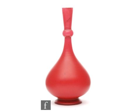 A late 19th Century cameo blank vase of footed ovoid form with knopped slender neck cased in ruby and opal, height 15cm.