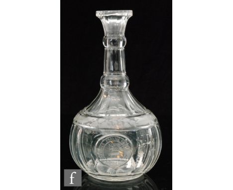 An early 19th Century carafe circa 1820 of globe and shaft form with lower slice cut body decorated with an oval cartouche pa