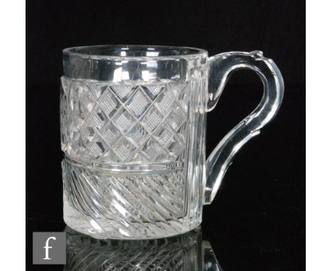 An early 19th Century tankard of cylindrical form with facet cut loop handle, decorated with a cartouche panel with monogram 