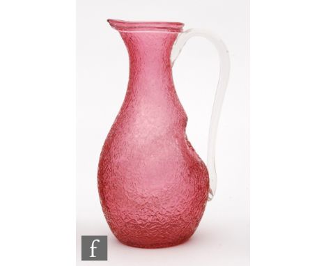 A late 19th Century Stourbridge glass champagne jug, of drawn ovoid form with crackled decoration to a cranberry ground, with