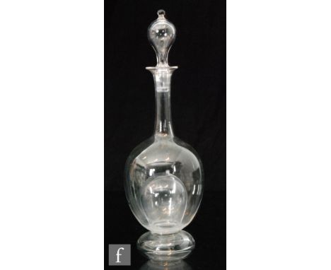 A late 19th Century Stourbridge crystal glass ice decanter with internal ice aperture to the body and conforming hollow blown