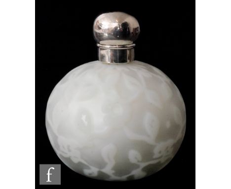 A 19th Century satin air trap scent bottle by Harrach of spherical form cased in clear crystal over an opal interior and deco