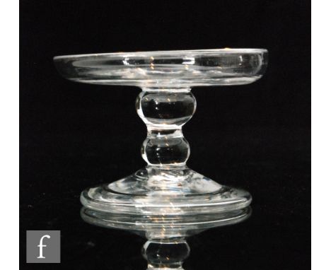 An 18th Century patch stand circa 1750, shallow circular dish with upturned rim above a double knopped stem, raised to a coni