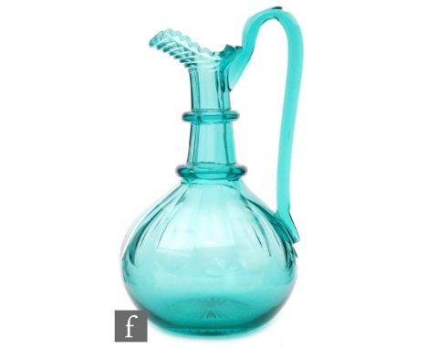 An early 19th Century claret jug with an ovoid base with slice cut shoulder below a two ring slice cut neck, mitre cut spout 