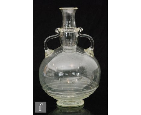 An early 20th Century James Powell &amp; Sons (Whitefriars) Roman inspired decanter in pale green, of footed globular form wi