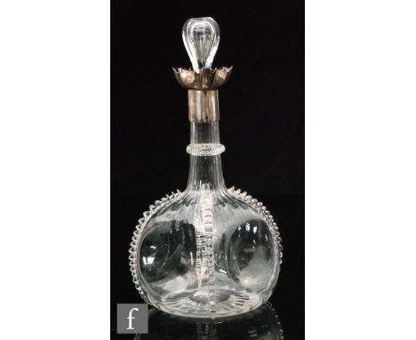 A late 19th Century Stuart &amp; Sons clear crystal decanter of globe and shaft form with dimple knocked sides and applied ri