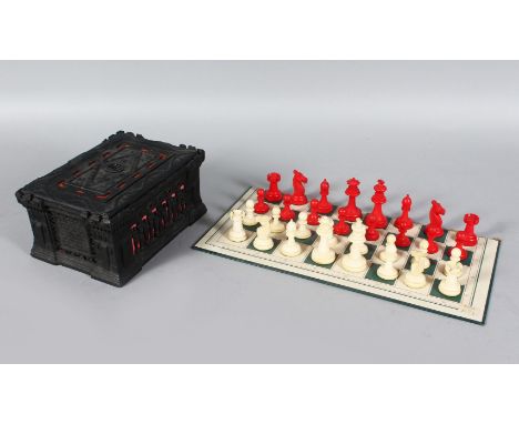 A STAUNTON RED AND WHITE BONE CHESS SET, King 7cms high, and GOTHIC design box, Circa. 1860.