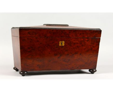 A GOOD VICTORIAN THUYA WOOD SARCOPHAGUS SHAPED TEA CADDY, with two compartments and a mixing bowl. 13ins wide.