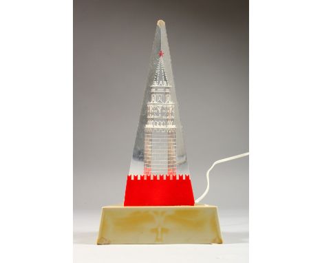 A RUSSIAN NOVELTY PERSPEX TABLE LAMP, depicting a clock tower. 12.5ins high.