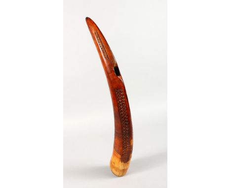 AN UNUSUAL CARVED IVORY TUSK PIPE OR MUSICAL INSTRUMENT, EARLY 20TH CENTURY, dark brown patination, possibly African. 18.5ins