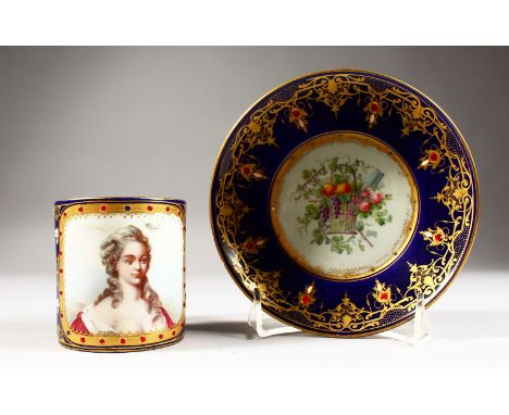 A FINE 19TH CENTURY SEVRES CUP AND SAUCER, rich blue ground painted with a portrait of Madam de Villeneuve, with pearl work a