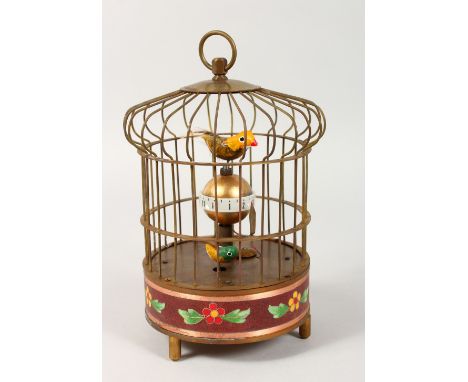 A NOVELTY BIRD CAGE TABLE CLOCK. 8ins high.